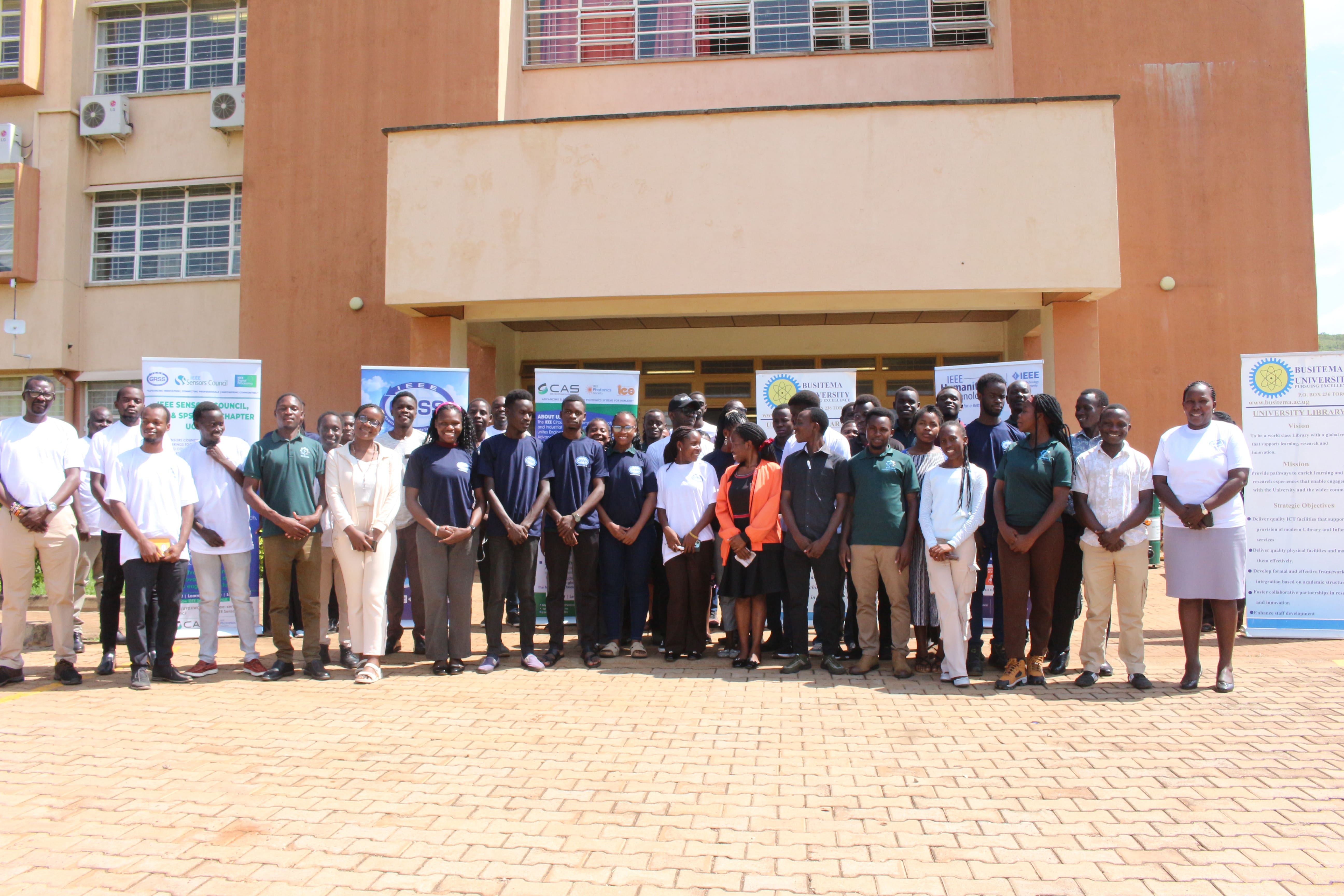 students and staff in a photo moment
